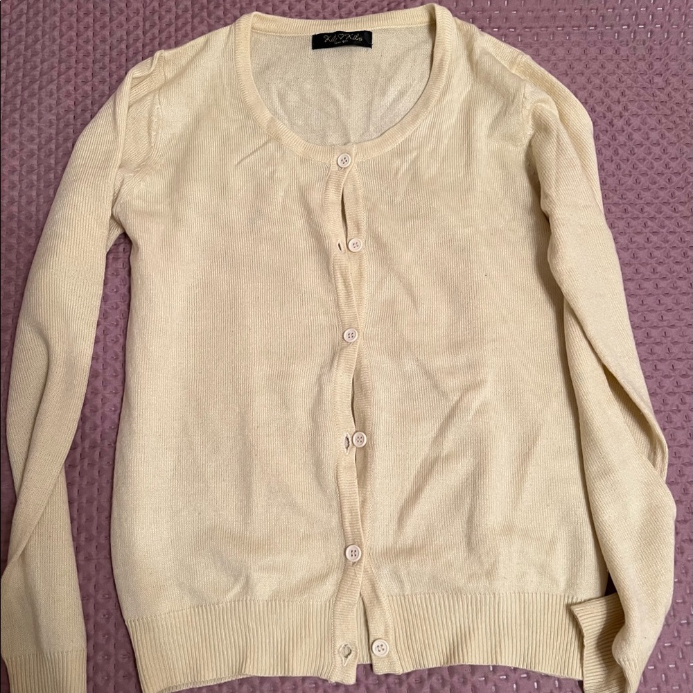 Yellow cardigan.
